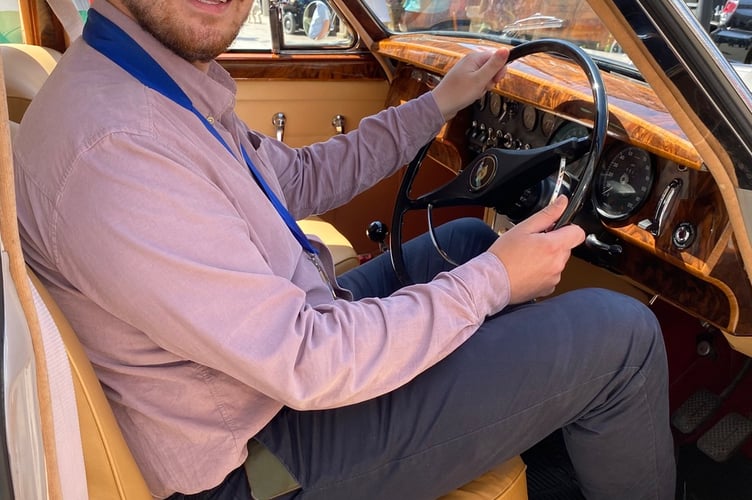 Cllr Alex Hall at the wheel of a Mk II Jaguar that caught his eye at the Newton Abbot classic vehicle show.
Picture: NATC (28-5-23)
