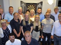 Charity darts team is thrilled to raise £1,000