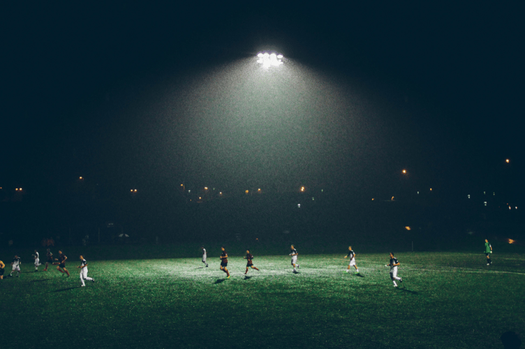 Flood lit football stock image 