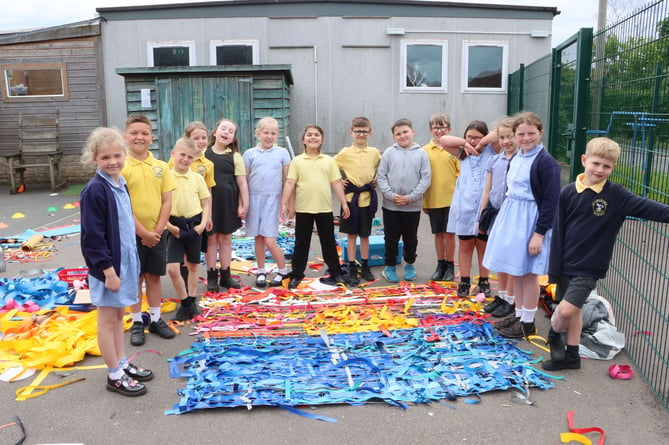 Children at Starcross Primary School with their decorated fencing 