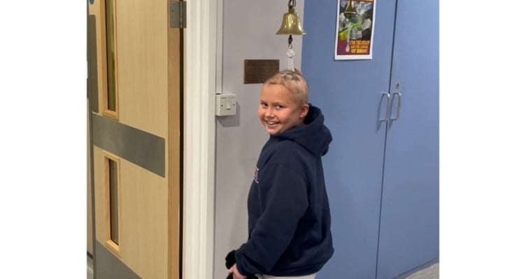 Francesca Walder ringing the bell at the end of her cancer treatment 