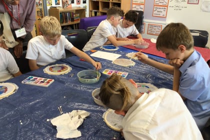 Children learn the art of silk painting 