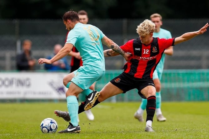 Ben Fowles in the thick of it for Tavistock AFC vs Ivybridge Town