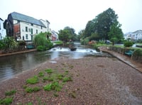 Volunteers wade in to clear waterway