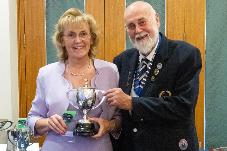 Tina Rowe, ladies champion, being presented by Rick Purnell