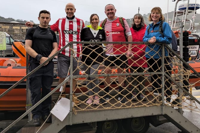 Walkers set off from Teignmouth  lifeboat station.