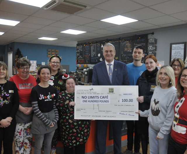 Funeral directors' Christmas cheque to community café