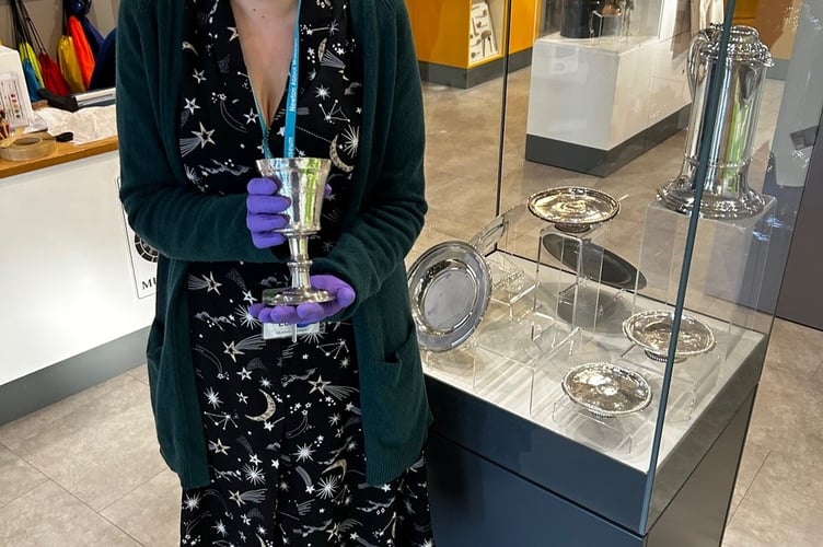 Curator Dr Charlotte Dixon with a piece of silverware on display at Newton Abbot Museum. Photo Nigel Canham 