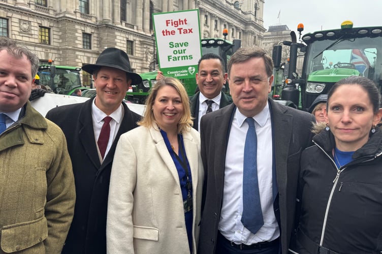 Central Devon MP Male Stride with some of the protesting farmers. 