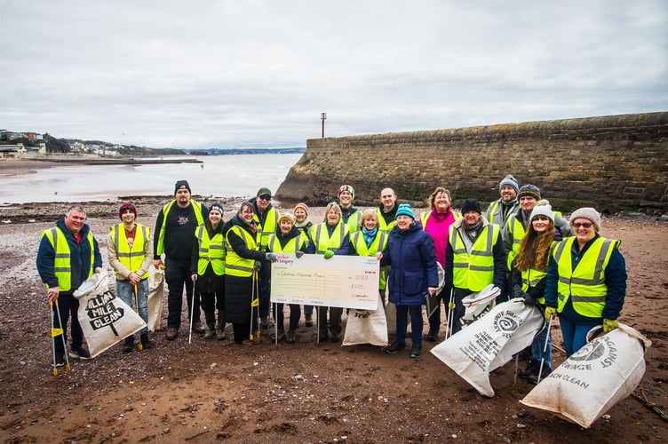 Dawlish Against Plastic receives £500 donation. Photo Taylor WImpey